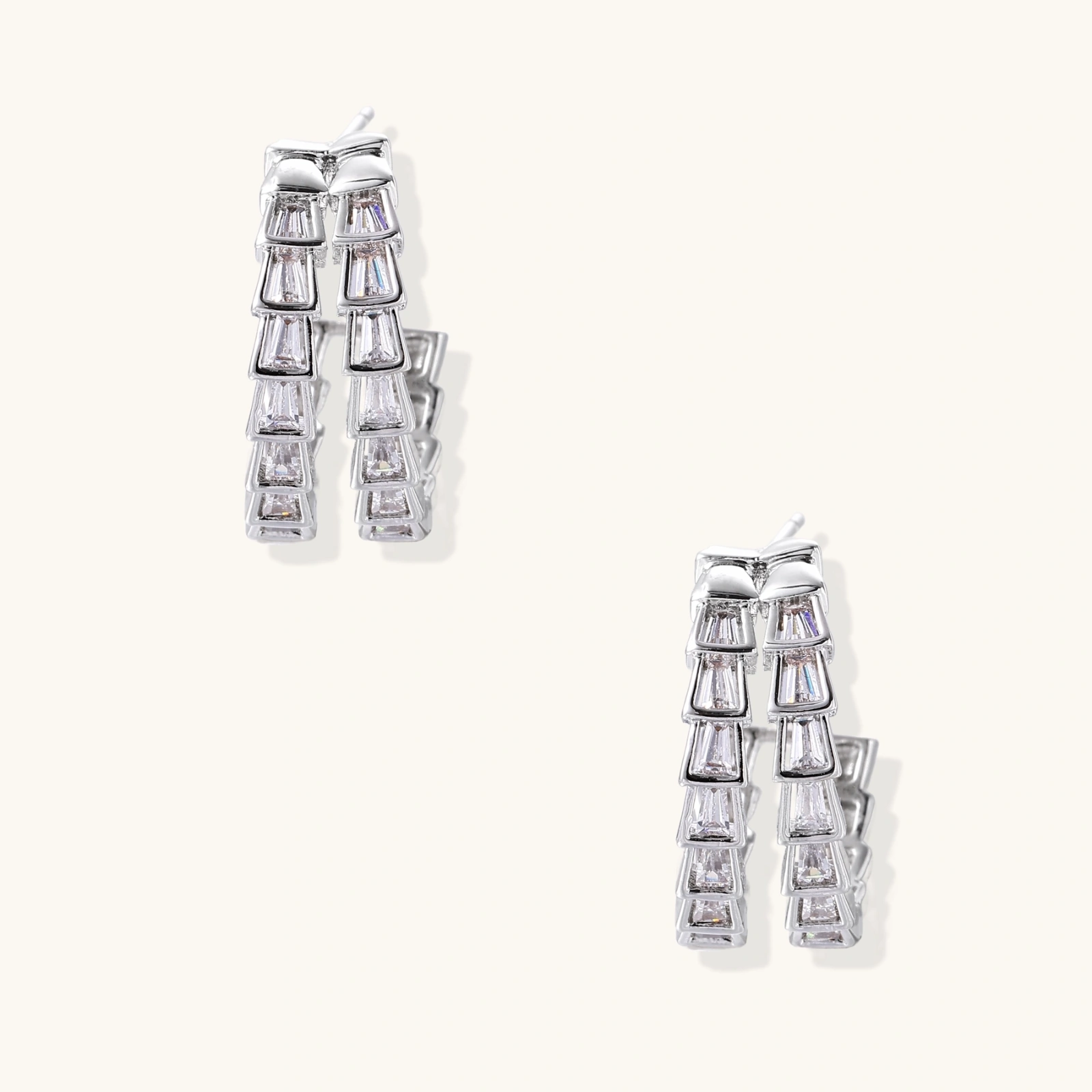 White gold-plated hoop earrings with double row of baguette-cut zirconia stones in geometric ladder design