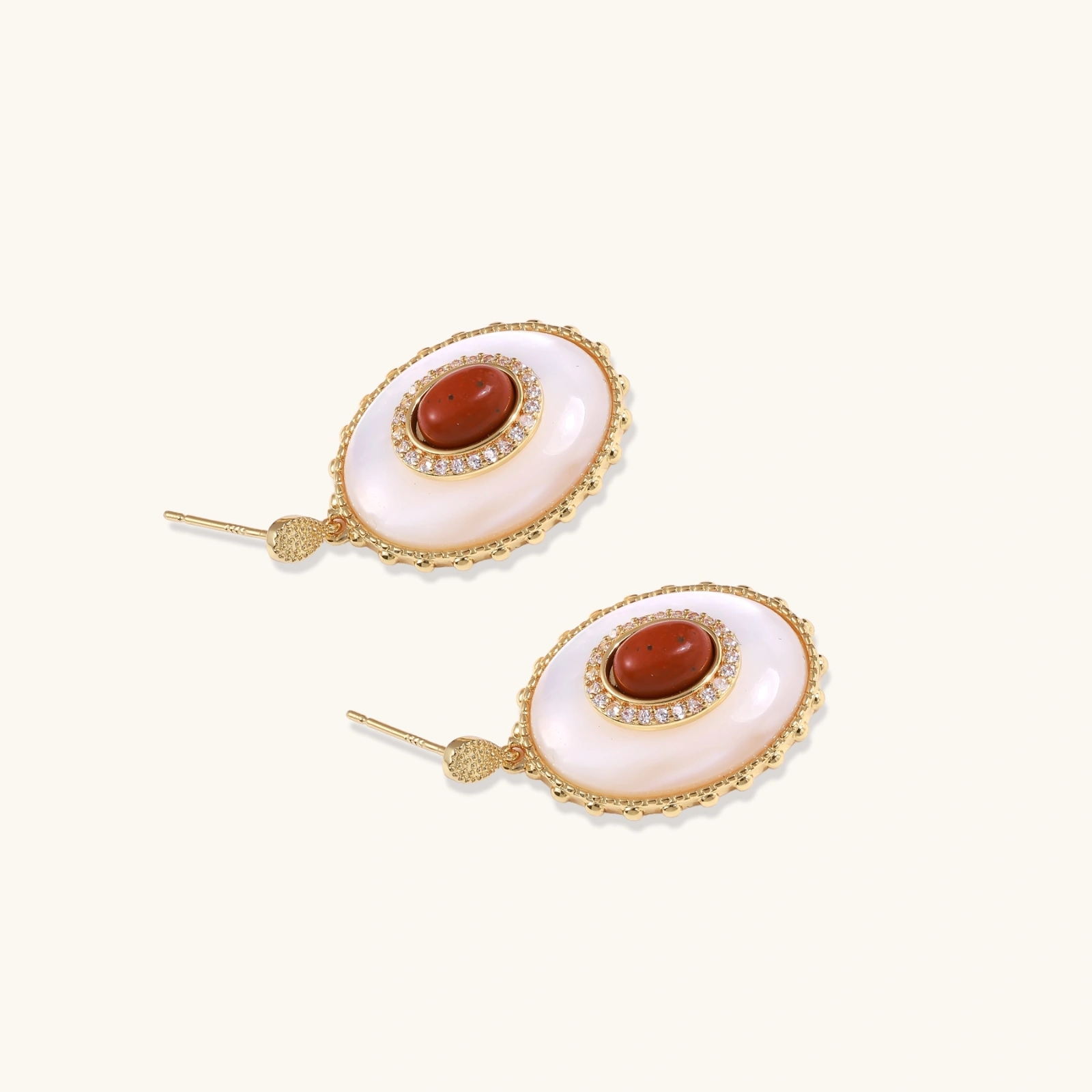 Gold-plated drop earrings with layered oval mother-of-pearl and cognac gemstone center framed by crystal halo