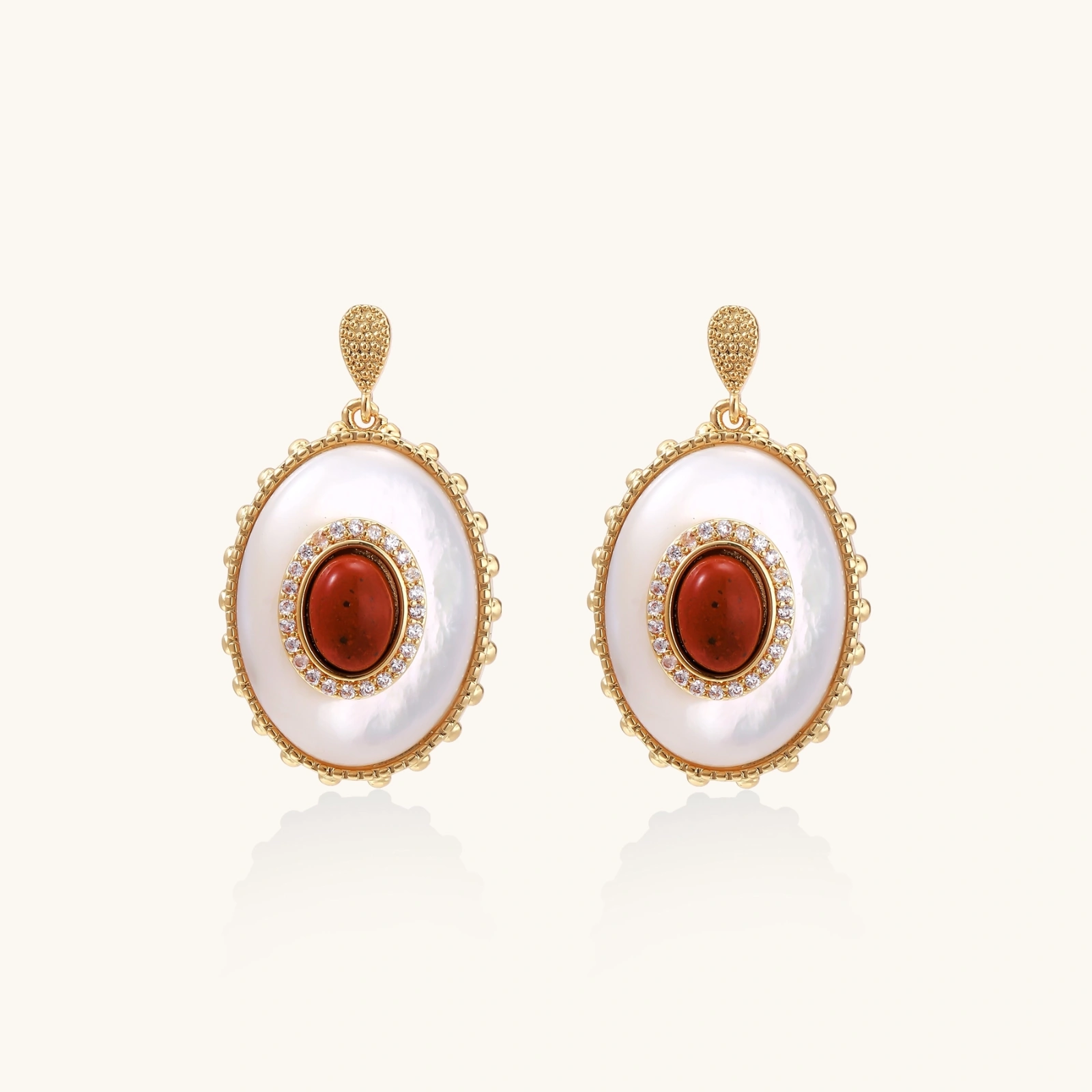 Gold-plated drop earrings with layered oval mother-of-pearl and cognac gemstone center framed by crystal halo