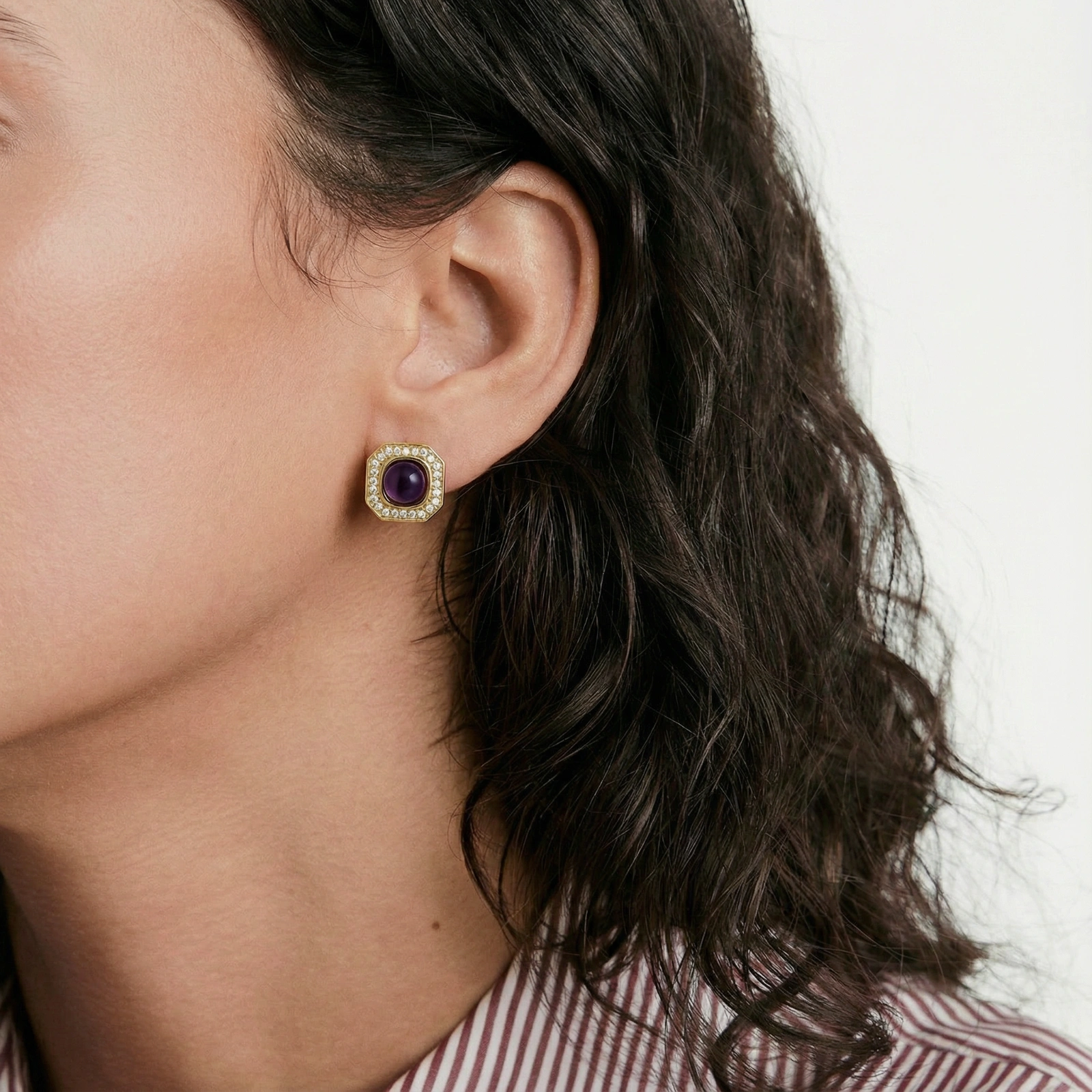 Gold-plated octagonal stud earrings with burgundy liuli centers and cubic zirconia halos on white background