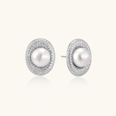 Elegant stud earrings with cream freshwater pearls surrounded by sparkly pavé crystals on rhodium-plated silver setting