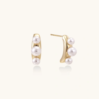 14K gold-plated curved stud earrings with three white freshwater pearls aligned vertically on cream background