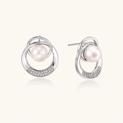 White gold-plated brass earrings with circular design, freshwater pearl center, and diamond accents