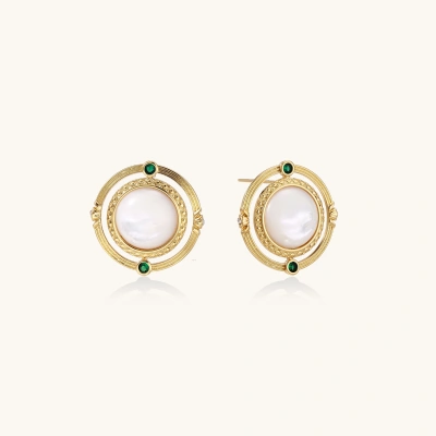 Circular gold stud earrings with iridescent mother-of-pearl center and green zirconia accents on cream background.