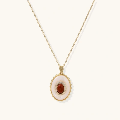 Gold pendant with oval mother-of-pearl frame, amber stone center, and crystal halo on delicate chain