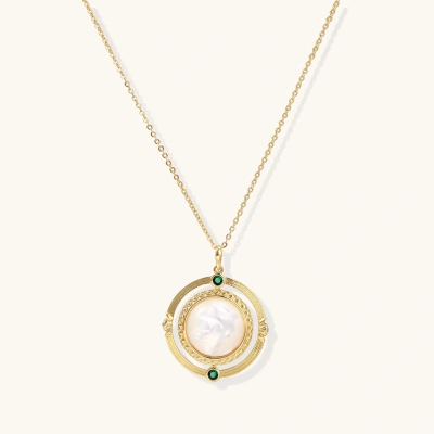 Gold pendant necklace with circular orbital design, iridescent mother-of-pearl center, and green zirconia accents