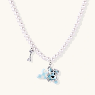 Pearl necklace with playful blue dog pendant accented with sparkly crystals on cream background.