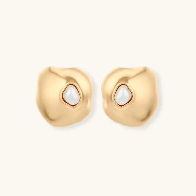 Organic-shaped eco-zinc alloy stud earrings with resin pearl centers and sterling silver posts on white background.