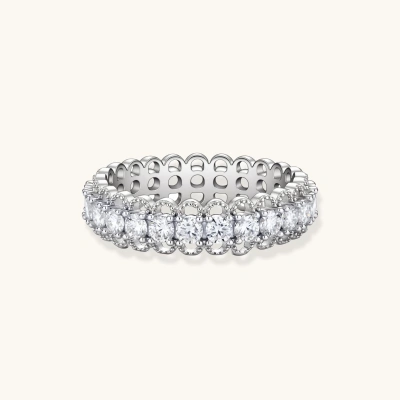 Sterling silver eternity ring with continuous row of brilliant moissanite stones in scalloped crown setting with milgrain detail