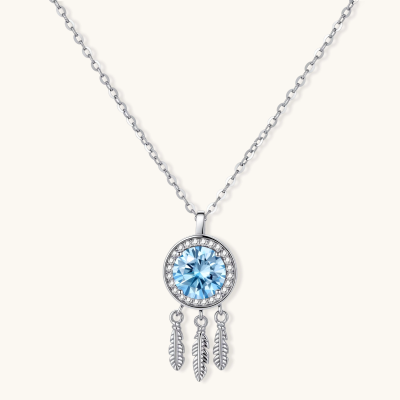 Sterling silver dreamcatcher pendant with blue moissanite center and three feather charms on adjustable chain.