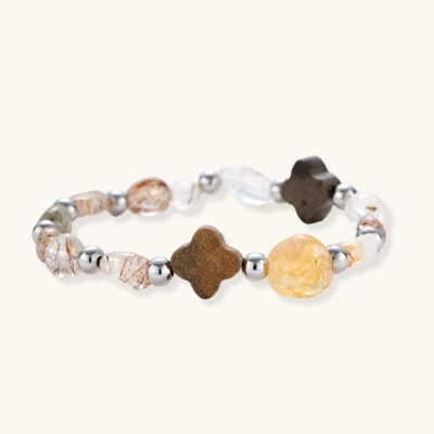 Stretch bracelet with coffee calcite, citrine, and black gold super seven stones mixed with silver beads on white background