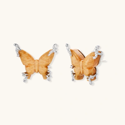 Wooden butterfly earrings with silver chain details in light and dark wood variants on white background