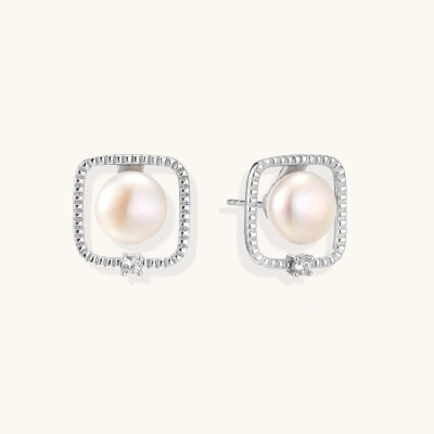Rhodium-plated silver stud earrings with cushion frame, centered freshwater pearl, and tiny crystal accent