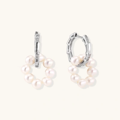 Rhodium-plated silver hoop earrings with freshwater pearls arranged in crescent formation and diamond accents