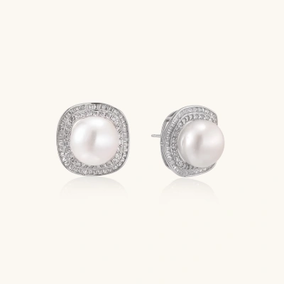 Rhodium-plated sterling silver stud earrings with round freshwater pearls surrounded by geometric crystal halos on cream background.
