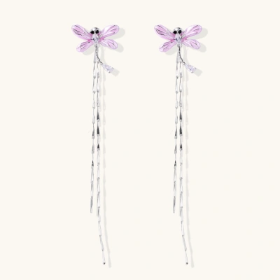 Long drop earrings with translucent lavender enamel dragonfly wings and white gold plated segmented bodies on white background