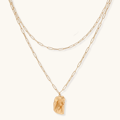 Layered paperclip chain necklace with organic flowing pendant made from eco-zinc alloy in warm gold finish