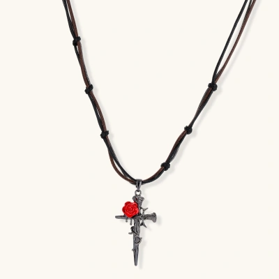 Gothic cross pendant with red enamel rose and thorn details on adjustable brown cord necklace against white background.