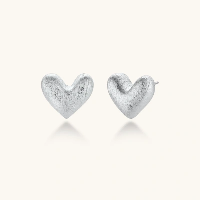 Pair of small heart-shaped stud earrings with brushed metallic finish, showing both silver and gold variants on neutral background.