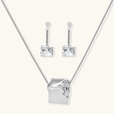 Geometric jewelry set with textured cube pendants on chains, featuring eco-zinc alloy in silver and gold finishes.