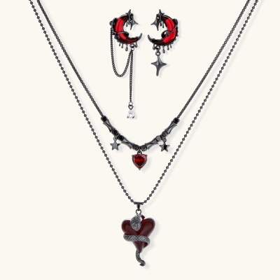 Gothic jewelry set with asymmetrical black metal earrings featuring red crescent moons, stars, and layered necklaces with heart pendants