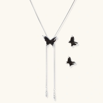 Dark wood butterfly earrings and necklace with silver chain accents on white background, showing natural grain texture.