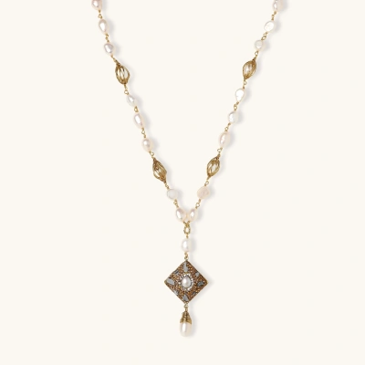 Y-shaped necklace with freshwater pearls, gold filigree stations, and ornate diamond-shaped centerpiece with pearl drop