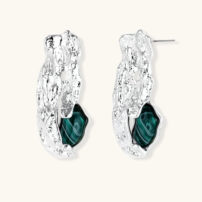 Organic-shaped stud earrings with hammered silver finish and green malachite-pattern resin stones on white background.