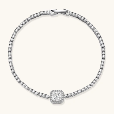 Sterling silver tennis bracelet with cushion-cut moissanite centerpiece surrounded by smaller stones in continuous setting