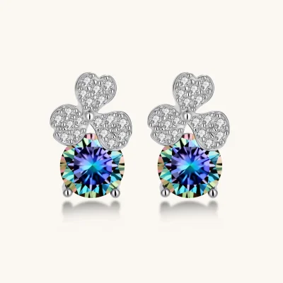 Sterling silver stud earrings with four-leaf clover design featuring small crystals above round moissanite stones