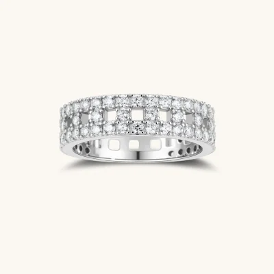 Wide sterling silver ring with three rows of brilliant moissanite stones in geometric pavé setting on white background