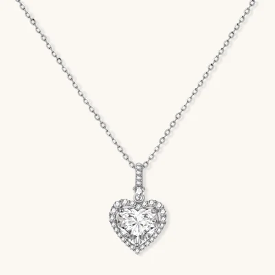 Sterling silver heart pendant necklace with brilliant moissanite center stone and halo setting on delicate chain
