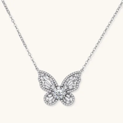 Sterling silver butterfly pendant with radiating design and central moissanite stone on adjustable chain
