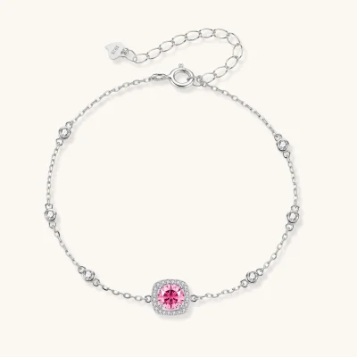 Elegant sterling silver chain bracelet featuring pink moissanite center stone in cushion halo setting with adjustable clasp