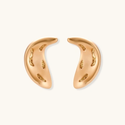 Pair of gold crescent moon-shaped stud earrings with textured surface details on cream background.