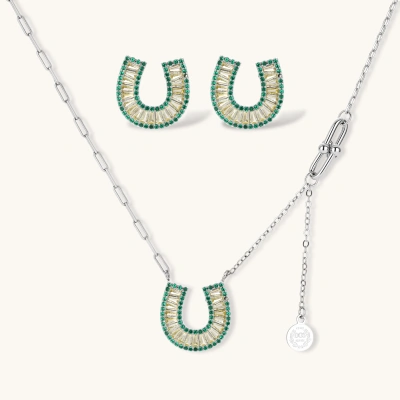 Geometric horseshoe-shaped jewelry set with radiating white zirconia center and jade-green border stones on white background.