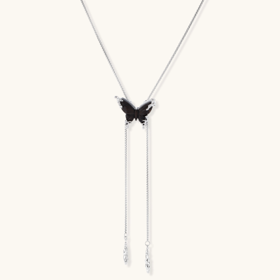 Wooden butterfly pendant necklace with cascading silver-toned chains on adjustable chain, available in amber and black.