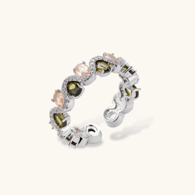 Adjustable copper ring with platinum plating, featuring alternating peach and green zirconia stones in organic wave pattern