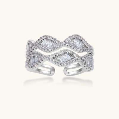 Layered adjustable ring with flowing wave design featuring baguette and round cubic zirconia stones in white gold plating