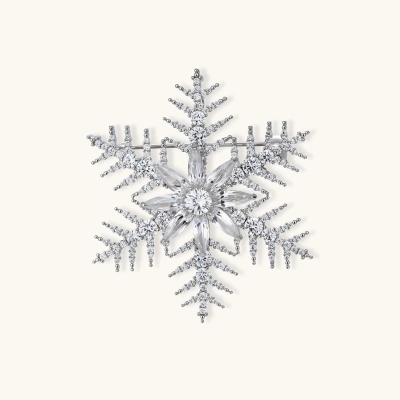 Intricate snowflake brooch with palladium-plated copper setting and sparkling zircon stones in radiating crystal pattern