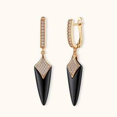 Rose gold-plated huggie earrings with pave zircon and black ceramic spike pendants on cream background.