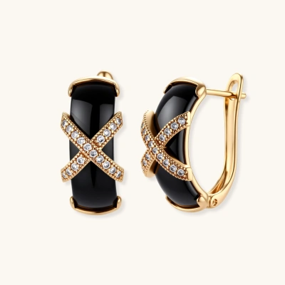 Gold-plated huggie earrings with black ceramic body and crystal-pavé X-cross motif, latch-back closure.