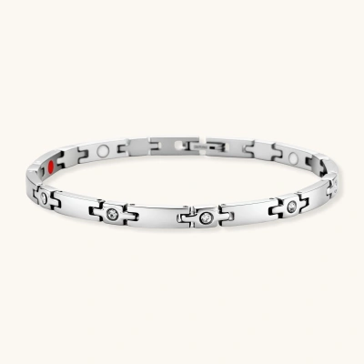 Silver stainless steel link bracelet with crystal-set cross connectors, polished bar links, and a red ceramic magnetic element.