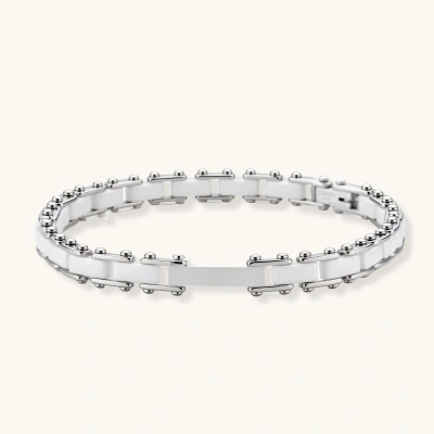 White ceramic and polished silver stainless steel link bracelet with ball-end connectors, shown on cream background.