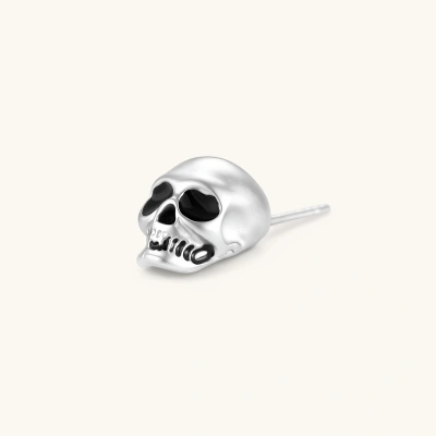 Matte silver skull stud earring with black enamel eye sockets and detailed teeth, post backing, 316L stainless steel.