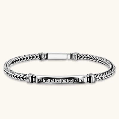 Silver stainless steel men's bracelet with braided foxtail chain, Greek key engraved bar, and decorative cube connectors.