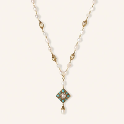 Y-shaped necklace with freshwater pearls, gold filigree stations, and ornate diamond-shaped centerpiece with pearl drop