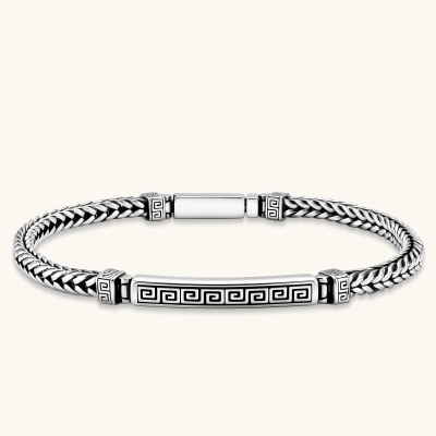 Silver stainless steel men's bracelet with braided foxtail chain, Greek key engraved bar, and decorative cube connectors.