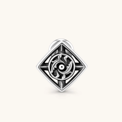 925 sterling silver square stud earring with oxidized black finish, swirling eye motif, and compass spike corners. 9.1mm.