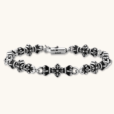 Oxidized 925 sterling silver bracelet with fleur-de-lis cross links, black-accented beads, and a cylindrical clasp stamped 2024.